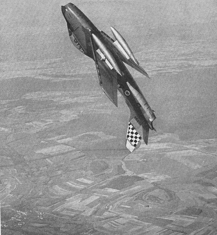 A Canadair Sabre 6 of No. 441 Sqn., R.C.A.F., seen approaching the top of a loop, with the automatic slats extended as the minimum airspeed is reached. With CF-100s, these Canadian fighters are on continual “Zulu” alert in Europe. Photograph copyright “The Aeroplane”