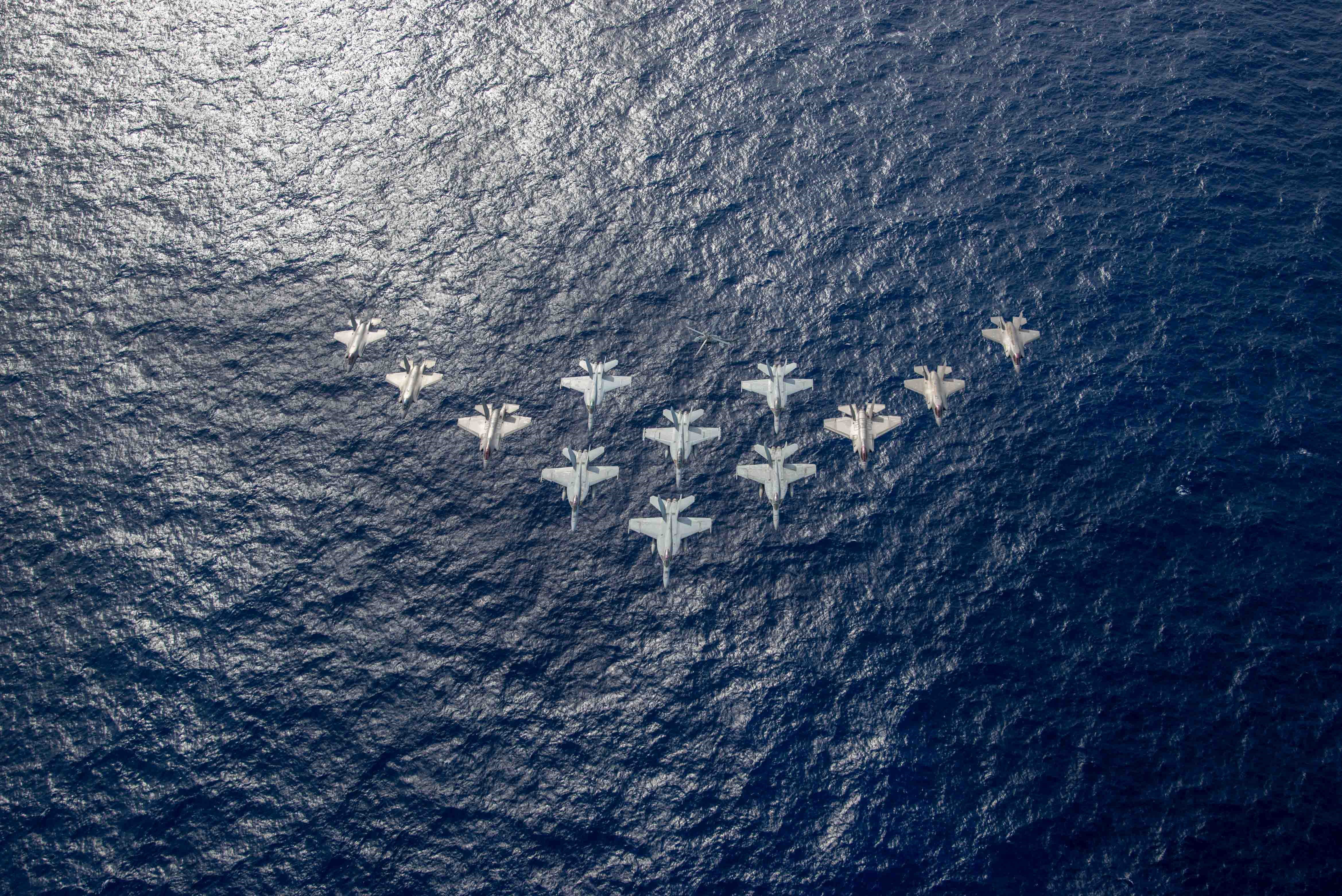 US Navy F/A-18E/Fs, F-35Cs and RAF/USMC F-35Bs flyover in Indo-Pacific 03-10-21 [US Navy]