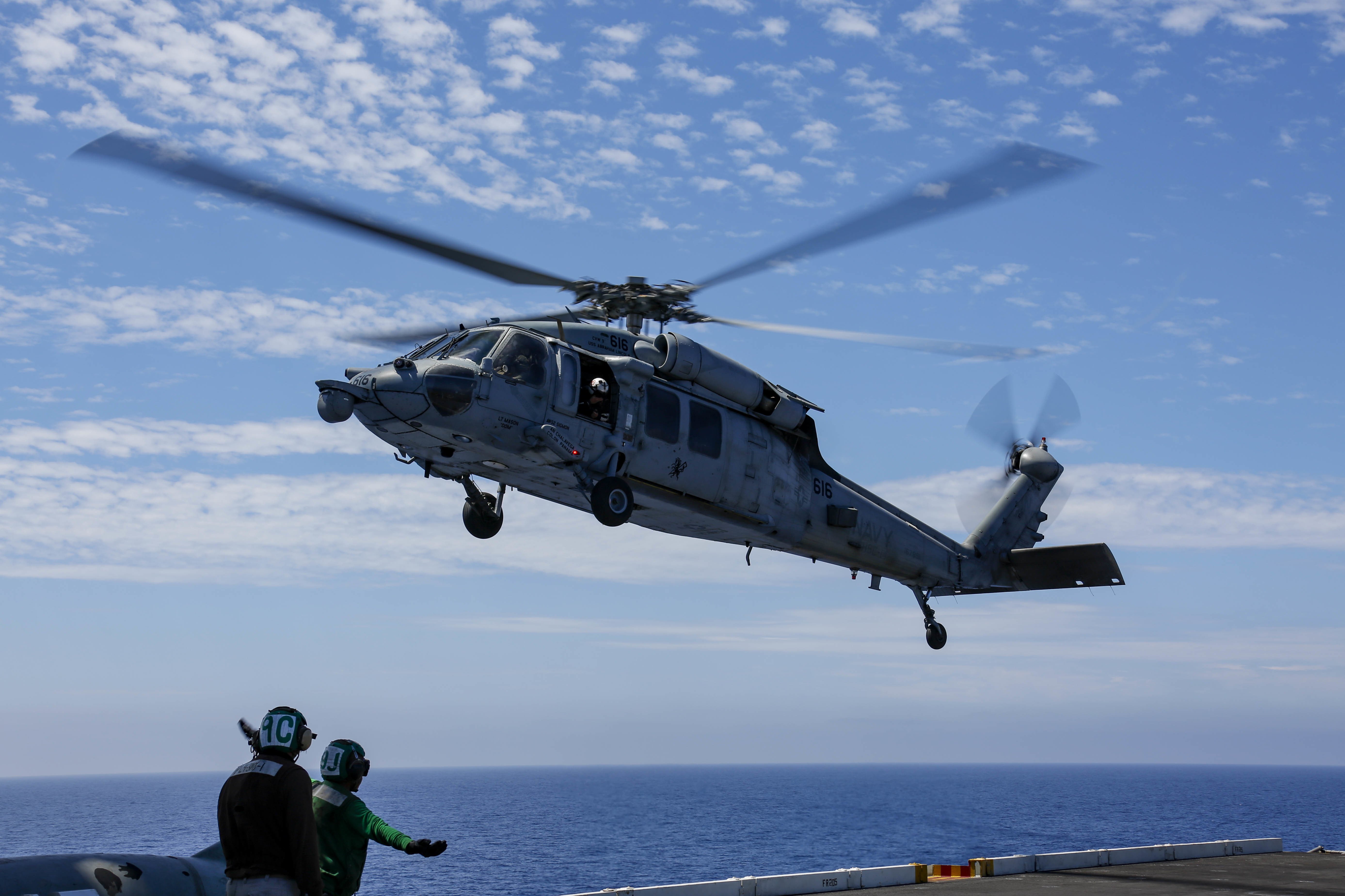 US Navy MH-60S lands on USS Abraham Lincoln 12-08-21 [US Navy - Mass Communication Specialist 3rd Class Michael Singley]