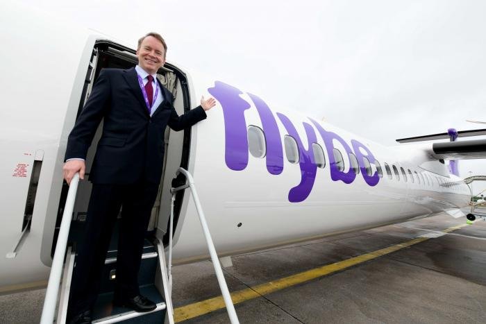 Launch-ready at Birmingham: Dave Pflieger, CEO of the new Flybe, on the steps of a Dash 8-400 – the carrier’s chosen fleet type