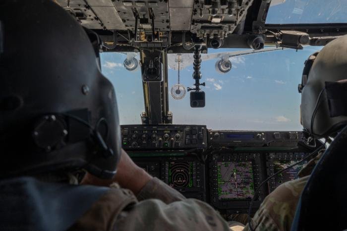 The perspective of the 20th SOS CV-22B Osprey tiltrotor aircrew as they approach a KC-46A Pegasus tanker from the 349th ARS to conduct the first ever in-air refueling operation between the two aircraft types over Cannon AFB, New Mexico, on June 1, 2022.