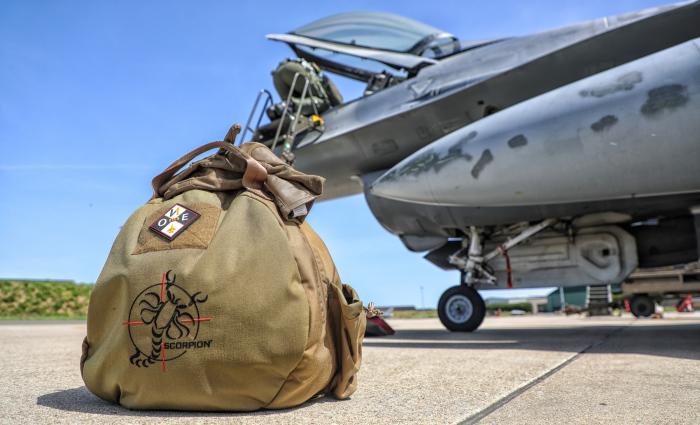 'OZ' preps the cockpit of his F-16AM (MLU) Fighting Falcon with his Scorpion helmet waiting to be worn for a BFM flight above the skies of florennes AB. 