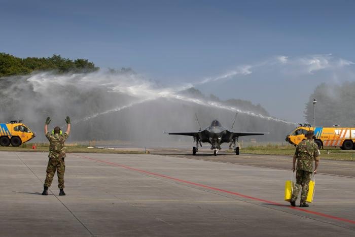 A Lockheed Martin F-35A Lightning II is provided a water salute as it enters Volkel AB's apron on June 30. This aircraft was one of four F-35s that 313 Squadron will now operate.