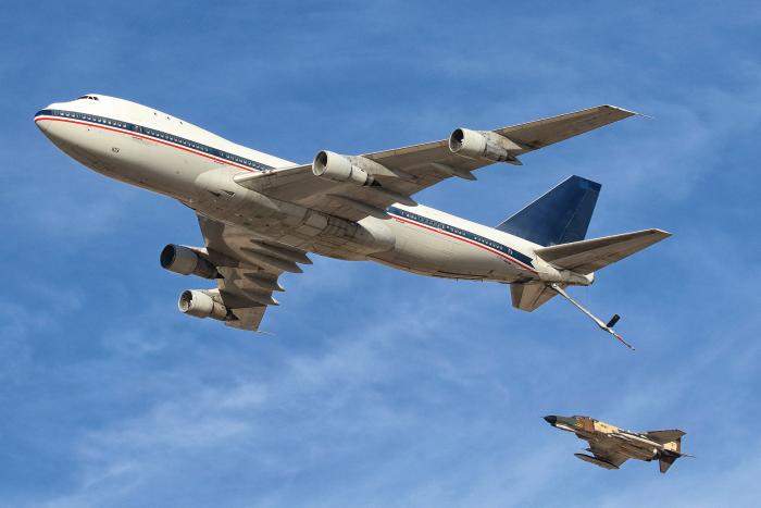 The unique Boeing 747 air-to air refuelling (AAR) tanker used by the IRIAF, seen here with an F-4E Phantom. The Boeing tankers were used for the attack on H-3 on 4 April 1981