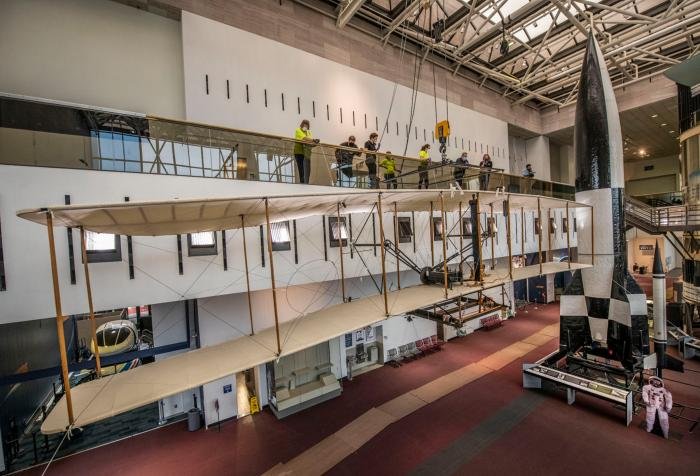 The Wright Flyer is lowered to the museum’s first floor earlier this year.