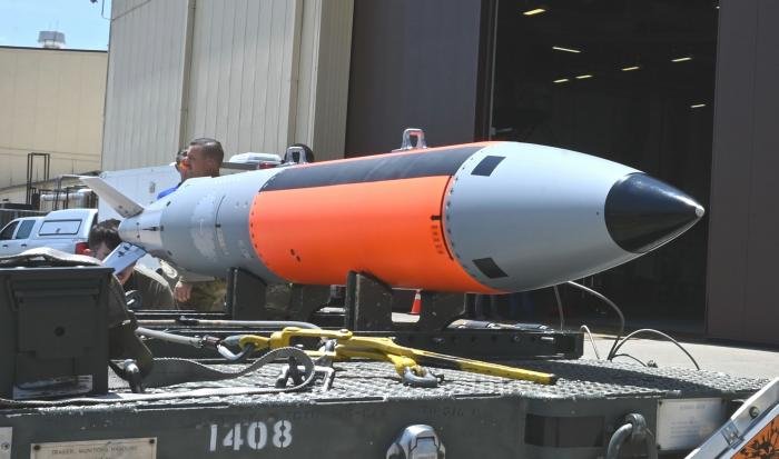 CAPTION
The 72nd Test and Evaluation Squadron prepares a new nuclear-capable weapons delivery system for the B-2 Spirit bomber to be test loaded on June 13 at Whiteman Air Force Base, Missouri.
