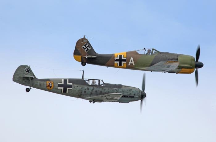 Two of the jewels in the FHCAM crown, Messerschmitt Bf 109E-3 Werknummer 1342 and Focke-Wulf Fw 190A-5 Werknummer 0151227, flying in formation at Paine Field.