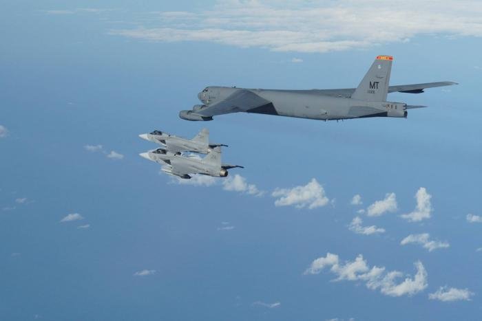 One of the four B-52Hs from the 5th BW,60-0026 'Dakota Avenger' flies in formation with two Saab JAS-39 Gripens