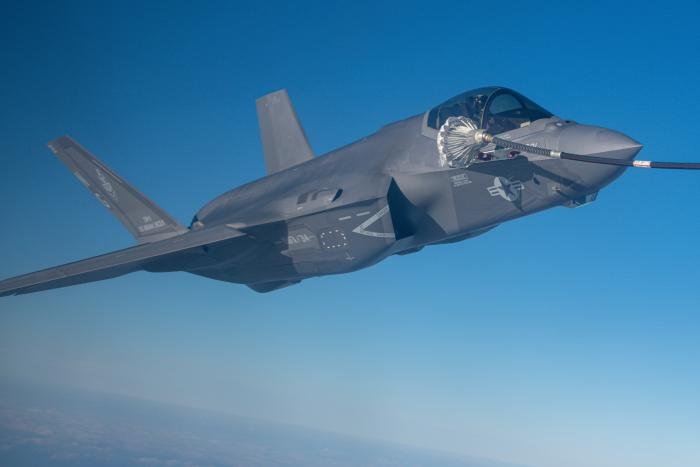 An F-35C Lightning II assigned to the USMC's VMFA-314 'Black Knights' receives fuel near Kadena Air Base in Okinawa, Japan, during Exercise Noble Fusion on February 6, 2022.