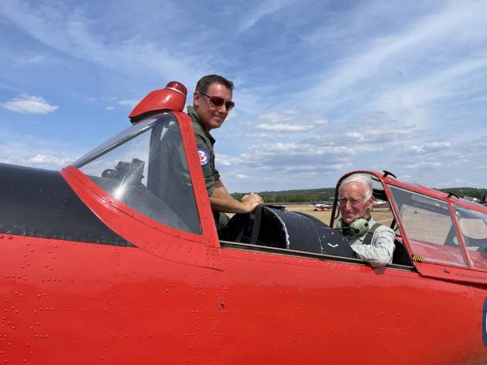 Retired Gp Capt Philip Pinney and one of the regular pilots of WP903, air experience flight instructor and airline pilot Robert Brinkley, with the royal Chipmunk at Goodwood on 14 August.