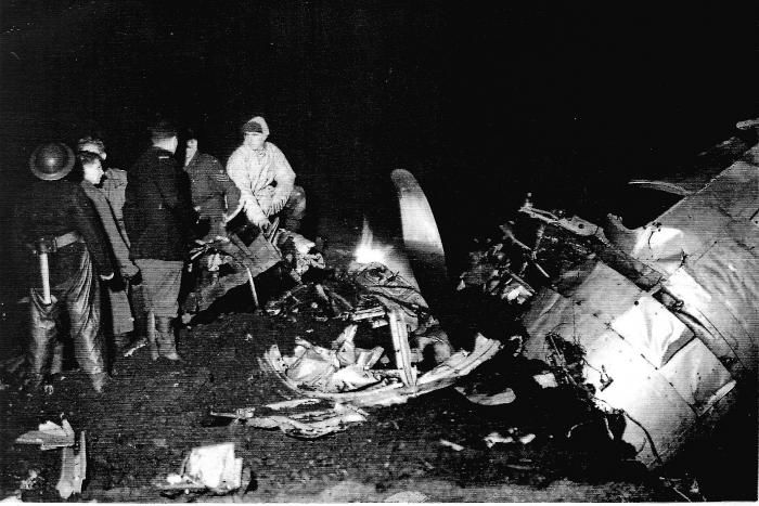 Personnel from the Glossop Fire Brigade and RAF Mountain Rescue Team from Harpur Hill take a moment to survey the wreckage of ‘Over Exposed’ while searching for survivors on November 3, 1948