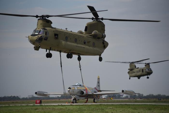 Boeing CH-47F Chinook (serial 10-08817) of the Iowa ARNG's Company B, 171st AVN, delivers a historic F-80 Shooting Star to the ANG paint facility in Sioux City, Iowa, on September 15, 2022.