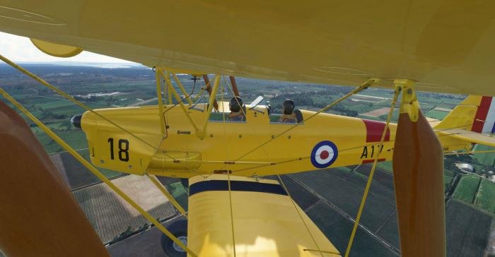 The Tiger Moth features a highly detailed model, including a pilot and co-pilot.