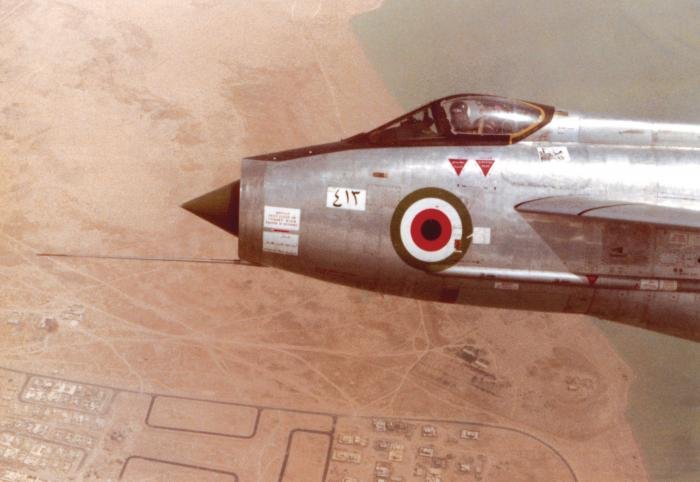 In close formation with F.53K 53-413 'E', which is being flown by Gerry Crumbie over Kuwait City in May 1970.  A retractable rocket pack is fitted beneath the nose in place of a Firestreak missile pack.