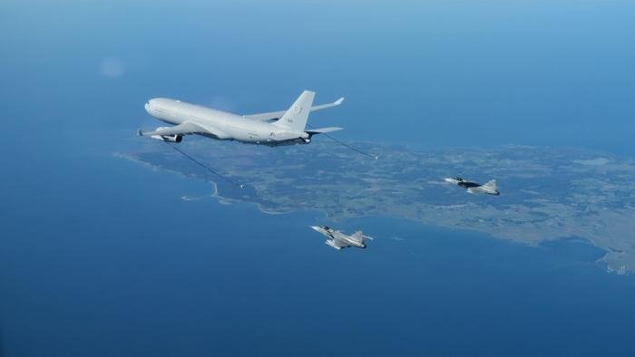 Airbus A330 MRTT during an air-to-air flight test operation with Swedish JAS-39 Gripen fighters.