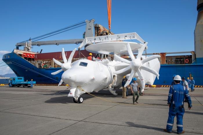 One of the two additional Northrop Grumman E-2D Advanced Hawkeyes delivered to the JASDF being unloaded from the general cargo ship, Ocean Gladiator, at Iwakuni on October 18, 2022. 