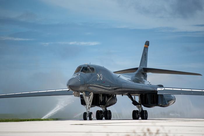 A Rockwell B-1B Lancer from the USAF's 37th BS 'Tigers' at Ellsworth AFB, South Dakota, taxis through a clean water wash station after arriving at Andersen AFB in Guam for a BTF deployment to the Indo-Pacific region on October 18, 2022.