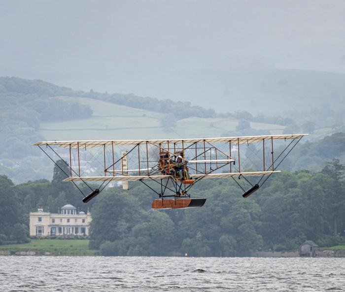 Pete Kynsey airborne in the Waterbird, registered G-WBRD, for the first time over Lake Windermere on 13 June, with the famous Storrs Hall Hotel at Bowness in the background.