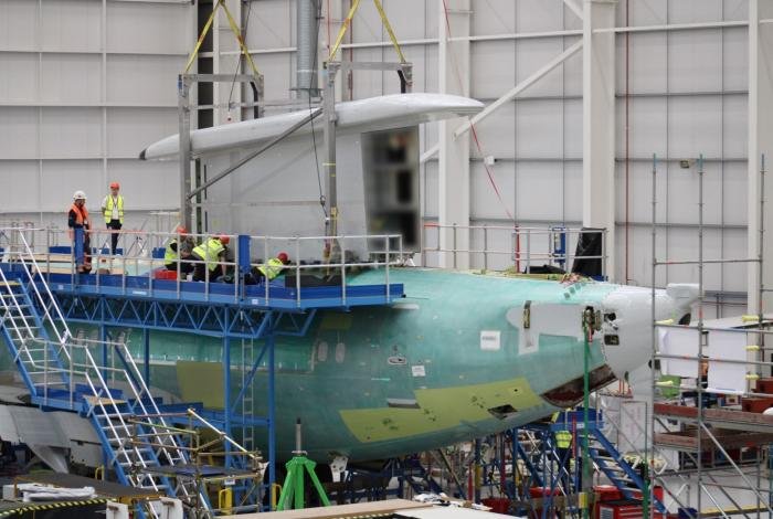 Engineers place the MESA sensor on to the reinforced fuselage of the E-7A Wedgetail