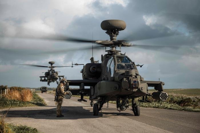Two AH-64Es of the AAC prepare to depart for a training mission during Exercise Talon Guardian