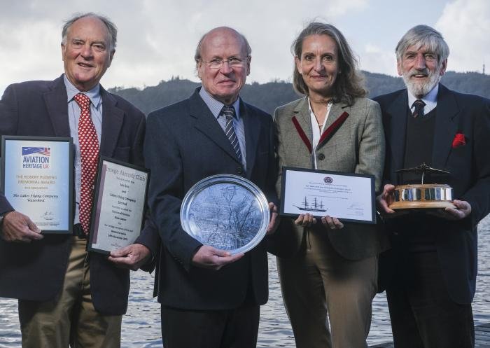 Lakes Flying Company trustees Paul Wrobel, Ian Gee, Kate Tripp and Adrian Legge by Windermere with their various awards.