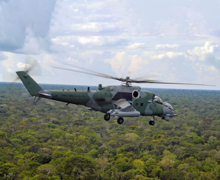 Viewed from another Hind, a Brazilian Mi-35M flies over the Amazon rainforest, in the Madeira River area. Considered very useful and effective by the aircrew, Brazilian Mi-35Ms were mainly used against illicit flights in the Amazon region, often from neighbouring countries.