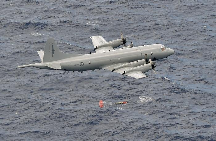 An RNZAF-operated P-3K2 Orion (serial NZ4204) launches a Mk.46 torpedo at low-level over the sea in a live-fire mission during the US-led Rim of the Pacific (RIMPAC) exercise in 2016. New Zealand will formally retire its P-3K2 fleet from operational service in January 2023.