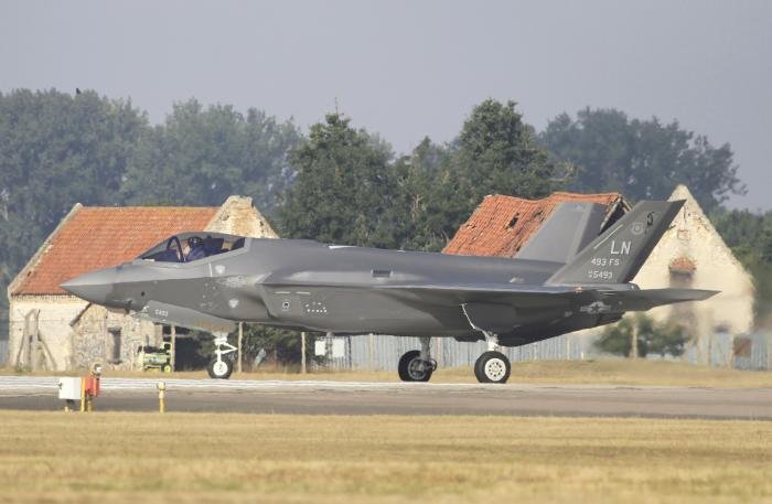 With the distinctive derelict building in the background 493rd FS F-35A 19-5493 taxing to runway 24 on August 28.