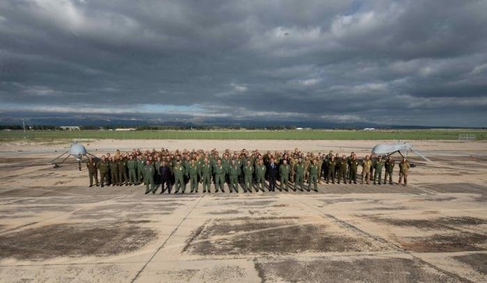 Members of 28 Gruppo pose in front of the now retired MQ-1C Predator plus