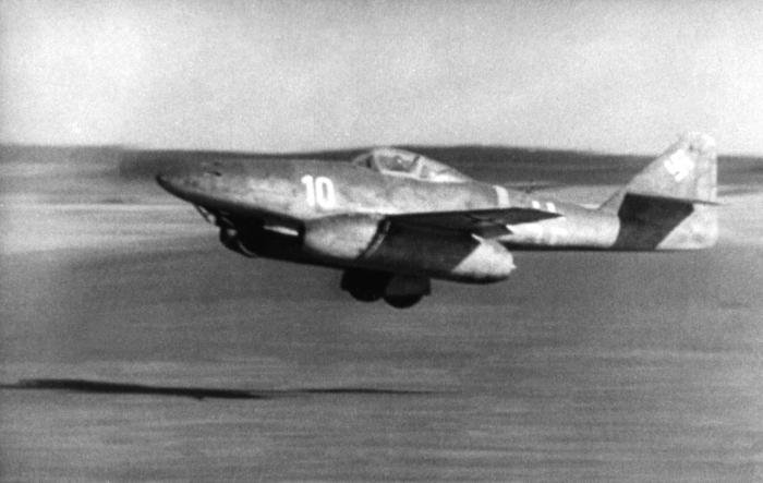 On take-off from Lechfeld, a III./EJG 2 Me 262A-1a tucks the gear up sharply.