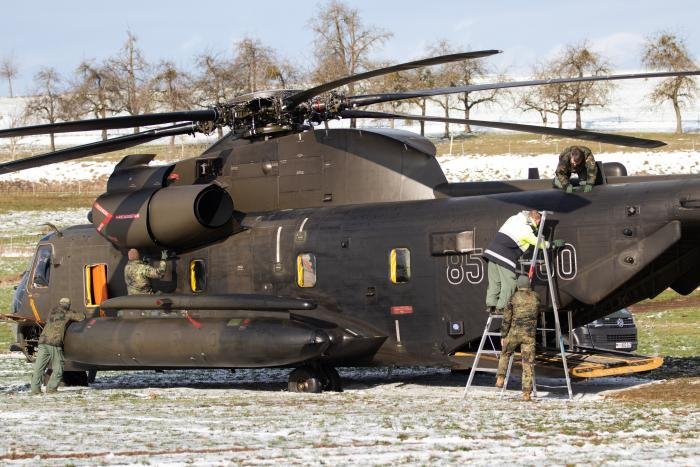 Luftwaffe technicians inspect CH-53GS (serial 85+00, c/n V65-098) after it was forced to make an emergency landing in a field near Pfullendorf, Baden-Württemberg, during a local training mission on January 31, 2023.