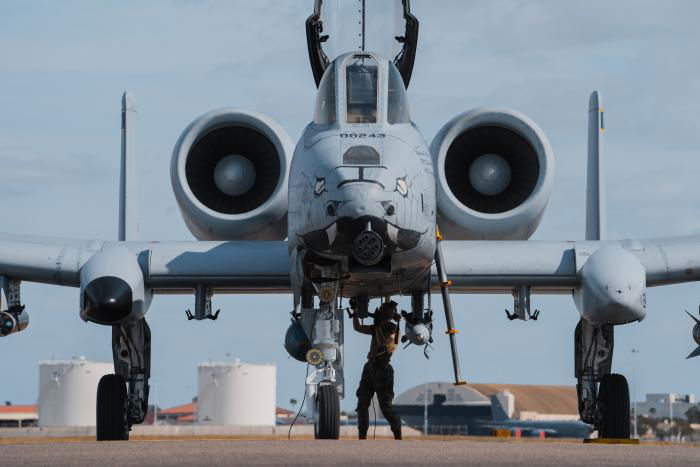 A crew chief assigned to the 122nd Aircraft Maintenance Squadron performs pre-flight maintenance on one of the 122nd FW A-10Cs that deployed to MacDill AFB, Florida, during Exercise Guardian Blitz on January 24, 2023. This image offers a good head on view of the 'Warthog' and the famed nose art that has been applied to the 21 aircraft operated by the 'Blacksnakes'.
