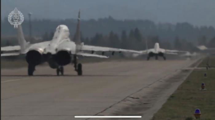 A pair of MiG-29's taxi to the active