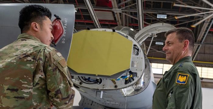 Staff Sgt Jackie Zheng (left), an avionics specialist assigned to the District of Columbia National Guard’s 113th Wing, briefs Lt Gen Michael A Loh (right), director of the US ANG, on the specifications of the AN/APG-83 SABR AESA radar now fitted to the F-16s assigned to the DCNG at Joint Base Andrews.