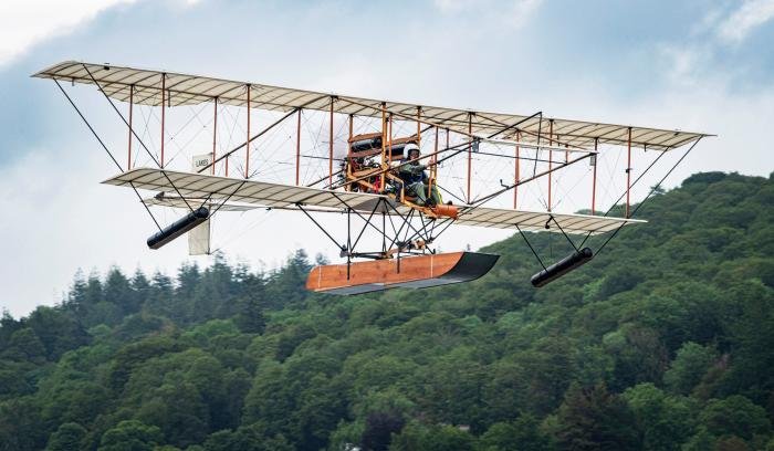 The Lakes Flying Company Waterbird replica climbs off Lake Windermere with Pete Kynsey at the helm.