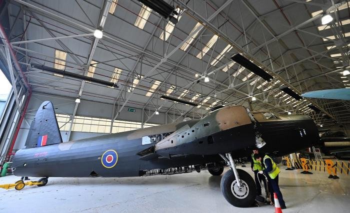 Wellington B.X MF 628 is manouvered into its new spot in Hangar 3 on April 20…
