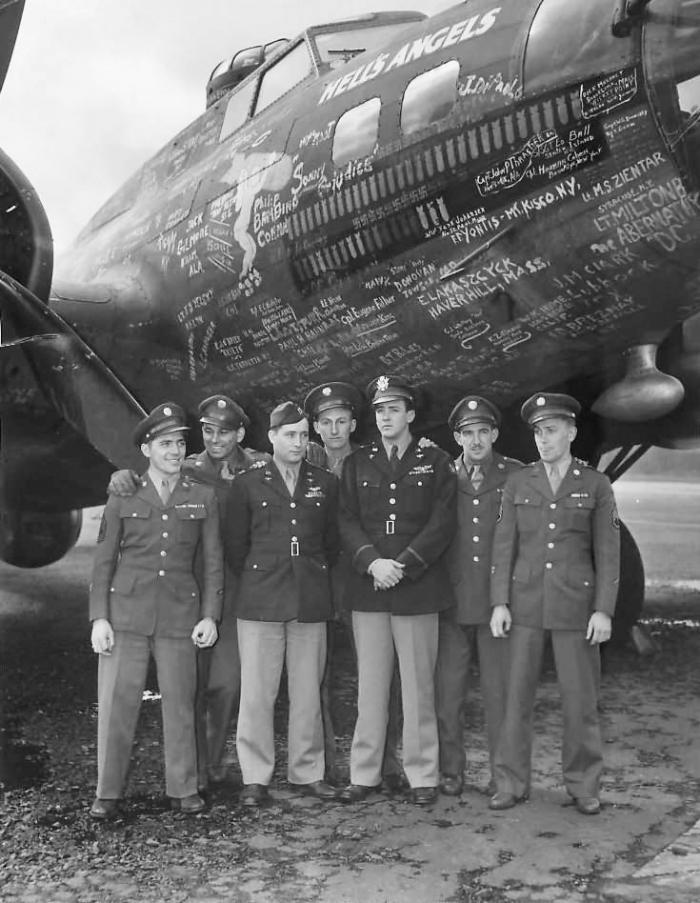 Crew members from B-17F Hell’s Angels, adorned with countless signatures.