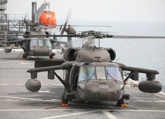 A pair of US Army UH-60M Black Hawks assigned to the New York ARNG’s 3-142nd AVN – but operating under the command of the 36th CAB – conducts deck landing training aboard the US Navy’s first purpose-built expeditionary mobile base vessel, USS Lewis B Puller (ESB-3), in the Persian Gulf on November 10, 2022.