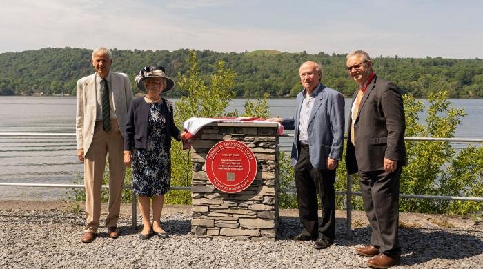 Lake District Estates chairman, Peter Hensman, His Majesty's Lord Lieutenant of Cumbria Claire Hensman, Lakes Flying Company chairman Ian Gee and Jerry Swift of the National Transport Trust unveil the Red Wheel.