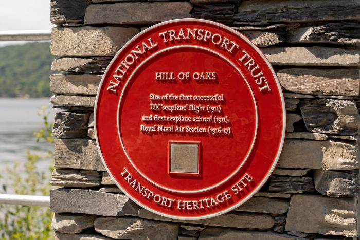 Detail of the Red Wheel plaque at Hill of Oaks.