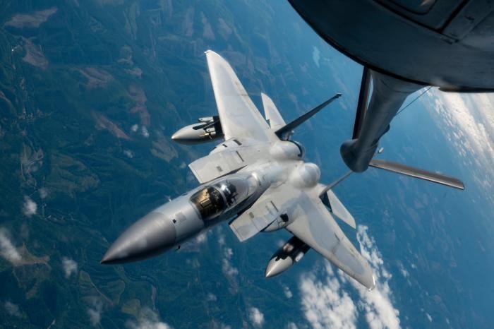 An F-15C Eagle from the Oregon ANG's 123rd Fighter Squadron 'Redhawks' - a part of the 142nd Wing at Portland ANGB - is refueled by a KC-135R Stratotanker assigned to the USAF's 92nd Air Refueling Wing, which is home-based at Fairchild AFB, Washington, over Oregon during Operational Centennial Contact on June 27.