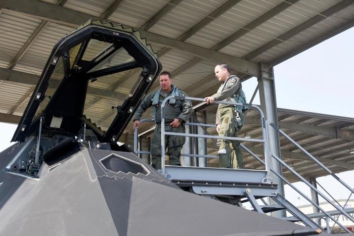 An F-117 Nighthawk pilot shows the cockpit to an F-15 Eagle pilot on the flightline of the 144th Fighter Wing located at the Fresno Air National Guard Base, California, on September 15, 2021.