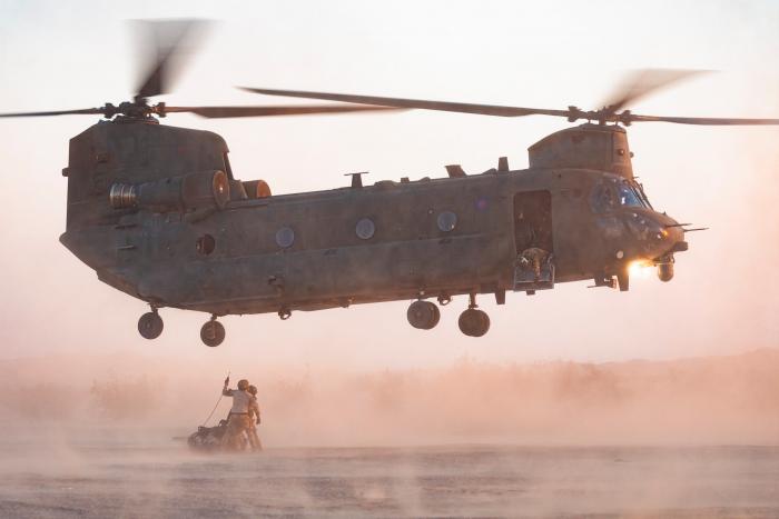 Personnel from the UK’s Joint Helicopter Support Squadron (JHSS) prepare to attach an underslung load to a Chinook HC6 from the RAF’s No 27 Squadron during Exercise Vortex Warrior at NAF El Centro in California on August 2.