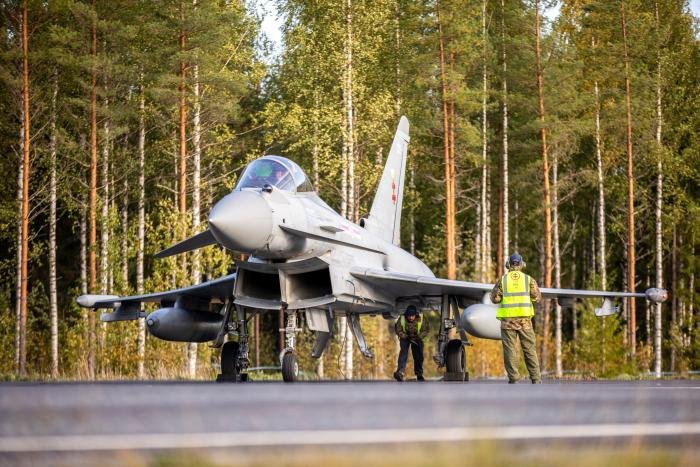 RAF  ground crew help to prepare an RAF Typhoon to take off from the road