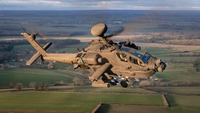 A well-lit study of the AH-64E as it banks past the camera-ship, highlighting some of the aircraft’s new aerials and sensors. Of note are the two Link-16 aerials fitted at the end of the stub-wings – an easy way to differentiate between the AH1 and E.