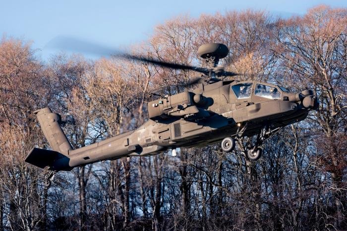 The Apache is just as at home in the field as a fully equipped airfield. Here, a lightly loaded aircraft lifts from a confined landing area during austere operations.