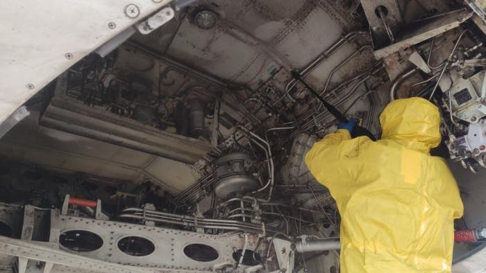 Ural Airlines says this picture depicts an engineer cleaning the hydraulic compartment.