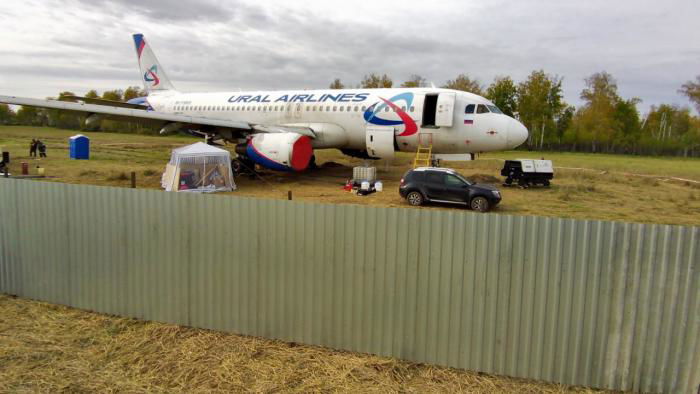 Ural Airlines has erected a fence surrounding the aircraft.