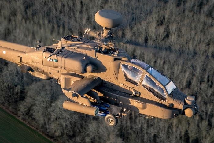 An AH-64E basks in the evening sun during an Exercise Talon Guardian. Thanks to its upgraded targeting systems and Link-16 data link, the Apache is just as lethal in the dark.