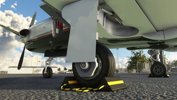 Wheel chocks that keep the aircraft still when the brakes are released.